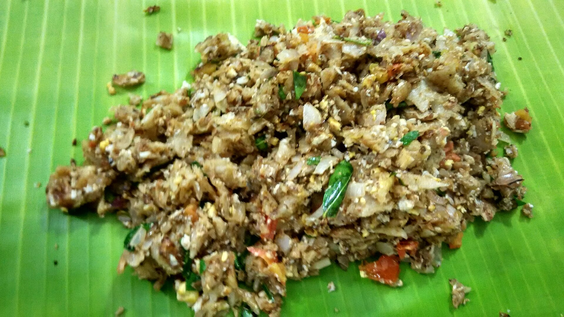 Kottu roti chopped on a griddle